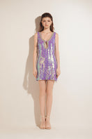 Purple Valenciani mini dress with sequins and a keyhole cutout, featuring a fitted silhouette and stylish design.