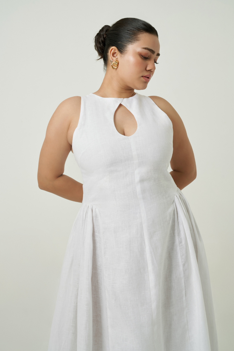 White Summer Away PISA midi dress displayed on a hanger, featuring a sleek, elegant design perfect for casual or semi-formal wear.