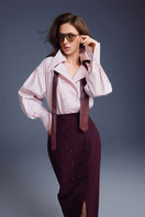 Keira Tong buttons sculpted maxi skirt featuring a sleek design with button accents, shown in a full-length view.