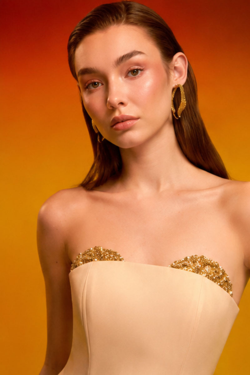 Elegant crystal bust gown by CEM featuring a fitted design with intricate crystal embellishments and flowing fabric.
