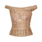 Gold hand-embellished CEM top featuring intricate embroidery and stylish design, displayed on a hanger against a neutral background.