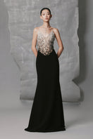 Black Phan Huy long straight round-neck gown with a sleek, elegant silhouette and simple design.