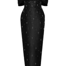 HACCHIC COUTURE Vivian black off-shoulder pencil gown displayed on a dress form, featuring a sleek fitted silhouette and off-shoulder neckline.