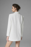 White Ontario mini skirt by Arti Apparel, shown with a fitted waist and stylish hem, perfect for casual or chic outfits.