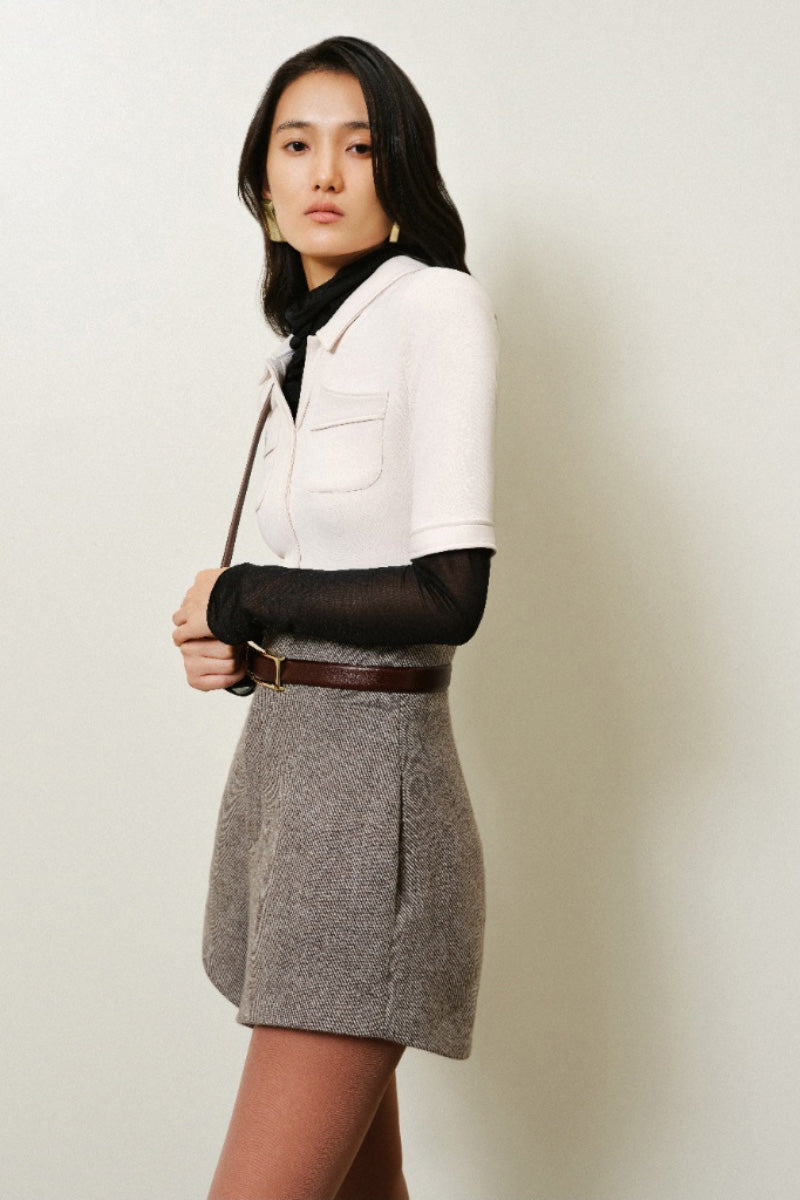 Lecia high-waist A-line shorts in light denim, featuring a fitted waist and flowing A-line silhouette, shown on a model.