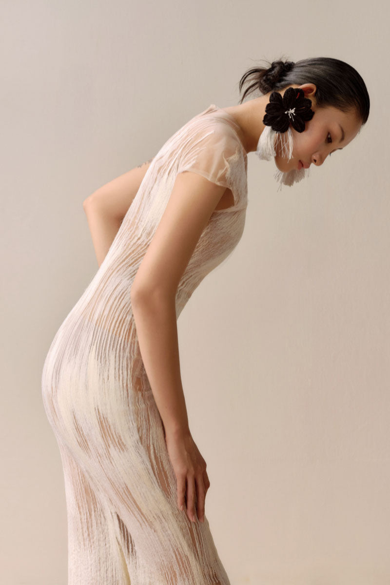 Leica Artisanale Ember in White midi dress featuring a flowy fabric and elegant design, perfect for stylish occasions.