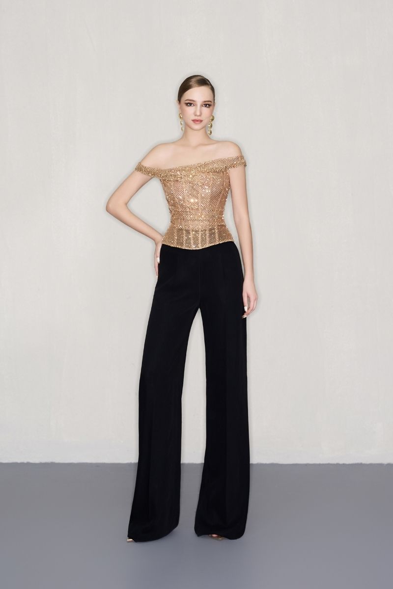 Gold hand-embellished CEM top featuring intricate detailing and a stylish design, perfect for elegant fashion looks.