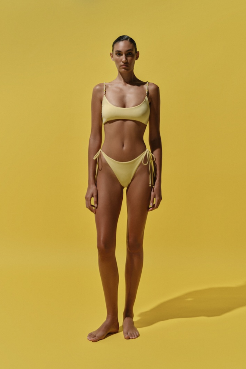 Baobab ITALA bikini bottom in Butter color, showing the stylish cut and smooth fabric of the swimwear on a plain background.