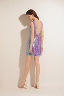 Purple Valenciani mini dress with sequin embellishments and a keyhole cutout, showcasing a stylish sleeveless design.