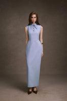 Pastel blue sleeveless shirt dress by Keira Tong, styled as a flowing maxi dress with a relaxed fit and lightweight fabric.