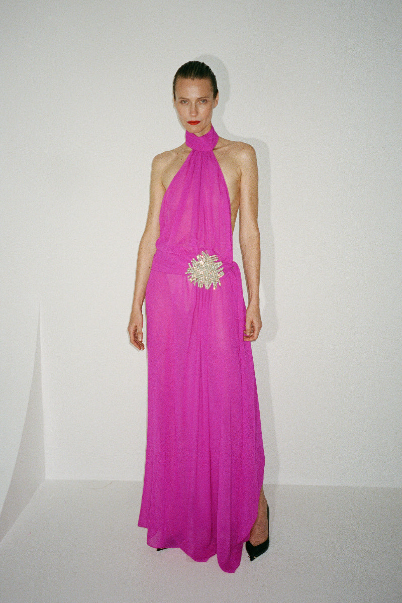 Nué Daphne gown displayed on a hanger, featuring elegant fabric and detailed design, perfect for formal occasions.