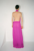 Nué Daphne gown displayed on a mannequin, elegant evening dress with intricate details and flowing fabric, perfect for formal occasions.
