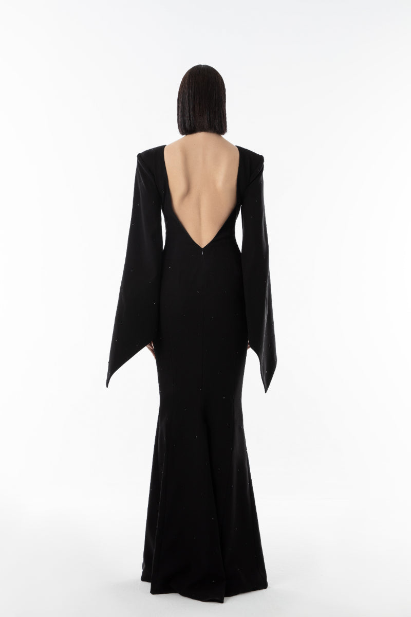 Lili Blanc black EMBER gown featuring a flowing fabric and elegant design, displayed on a mannequin.