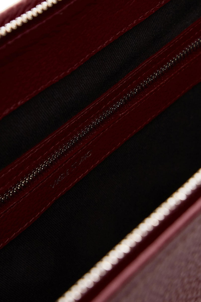 VIKELE STUDIO Denise shoulder bag in burgundy with a sleek design and adjustable strap, perfect for everyday use.