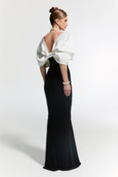 Nur Karaata CULT MIA X NUR KARAATA Buckingham gown, elegant black gown with intricate lace details and flowing fabric.