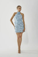 Deme By Gabriella ADA ICE BLUE Ruffle Mini Dress displayed with ruffle details and a fitted silhouette in icy blue fabric.