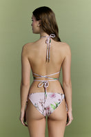 Nur Karaata Sunset Palms bikini, tropical print swimwear with palm tree design, on a model showcasing the stylish bikini top and bottom.