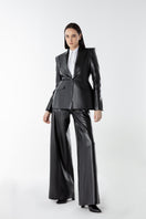 Lili Blanc vegan core trousers, stylish pants in a relaxed fit with a neutral color, showcasing front view and waistband details.