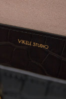 Black CELINE mini top handle bag by VIKELE STUDIO with sleek design and compact shape, ideal for stylish everyday use.