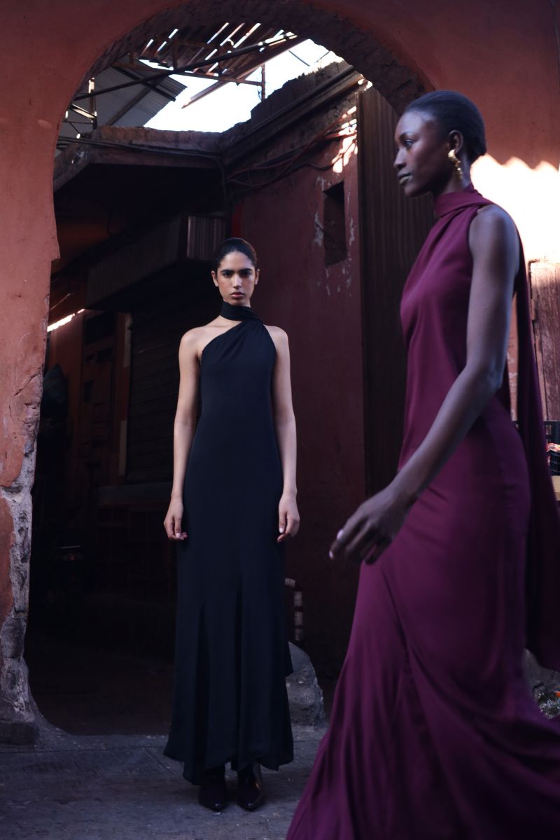 Black Baobab ARI Maxi Dress featuring a flowing silhouette and elegant design, perfect for casual or formal occasions.