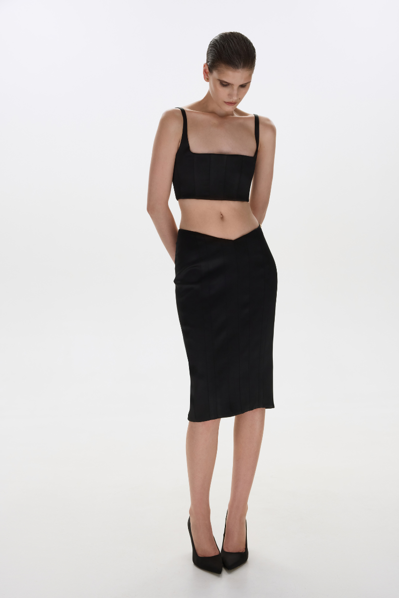 Black matte silk top with thin straps by BALYKINA, showing the smooth fabric and stylish shoulder design.