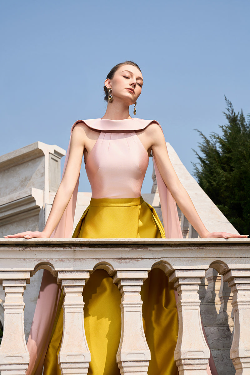 Pink and yellow bamboo taffeta gown by Tracy Studio, showcasing a flowing, elegant design with intricate fabric details.