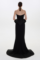 Black Nora gown by Balykina, elegant evening gown with flowing fabric and sophisticated design, shown on a model.
