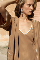 Luxurious Not Just Pajama Gloss of Water Hydrasilk Luxe robe in silky fabric, displayed hanging with a soft, elegant drape.