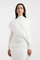 Deme By Gabriella Nadia white draped gown with flowing fabric and elegant design, showcased on a model.