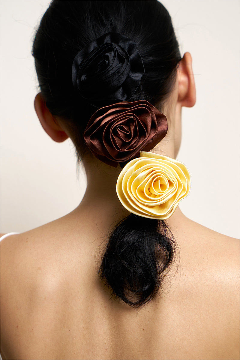 Luxurious Tuscan Rose silk scrunchies from Not Just Pajama, soft hair accessories with a smooth, shiny silk finish.