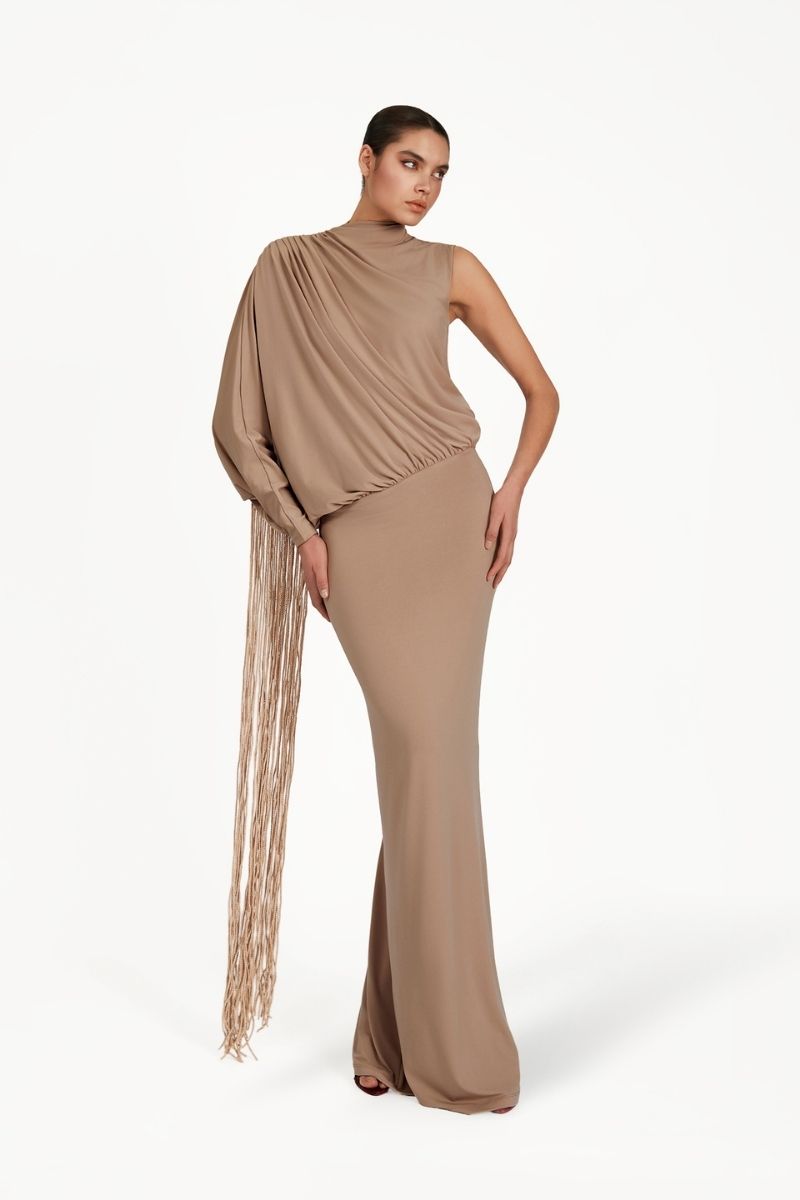 Khanum's taupe maxi dress with a flowing silhouette, featuring elegant fabric and a stylish, comfortable design.