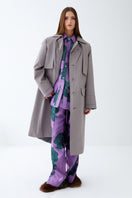Gray ColoReve trench coat for women, stylish jacket with classic design and button details, suitable for rainy weather.