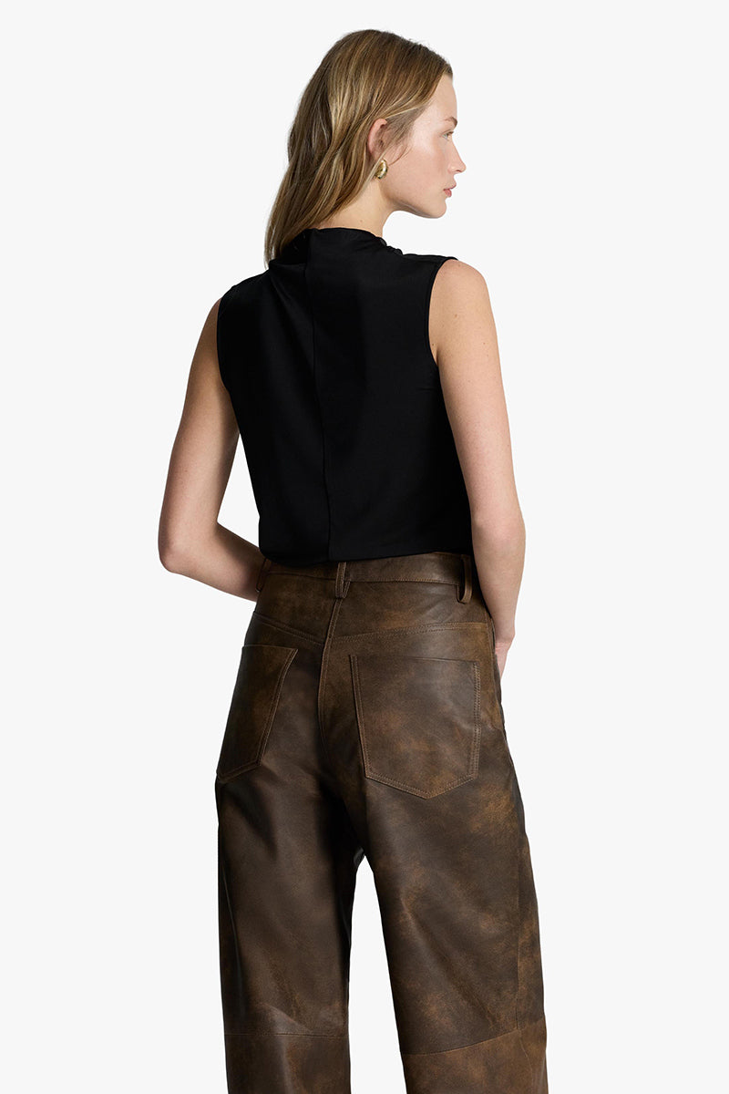 Root washed leather pants by Acaria Studio, stylish pants made from soft, washed leather, displayed on a neutral background.
