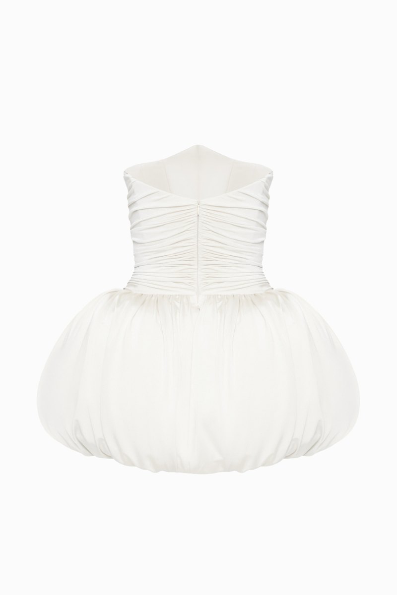 BalYKINA Clara Ivory Mini Dress displayed on a hanger, showcasing its elegant design and soft fabric for stylish occasions.