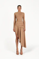 Khanum's Kasmina tan mini dress displayed on a hanger with a fitted silhouette and sleeveless design.