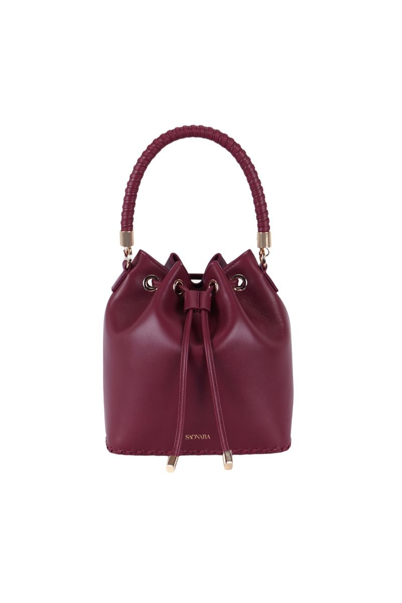 Saonara Berry Bucket Top Handle Bag showing a stylish round bag with top handle and textured berry design.
