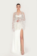 Embroidered feather cape jacket by Monika Dimova featuring intricate embroidery and flowing feather details.