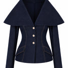 Lili Blanc Astra denim blazer, fitted with classic collar, button closure, and distressed denim fabric, styled on a model.