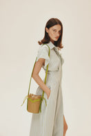 Beige VIKELE STUDIO Mini Bucket Bag with shoulder strap, compact design, and stylish appearance.