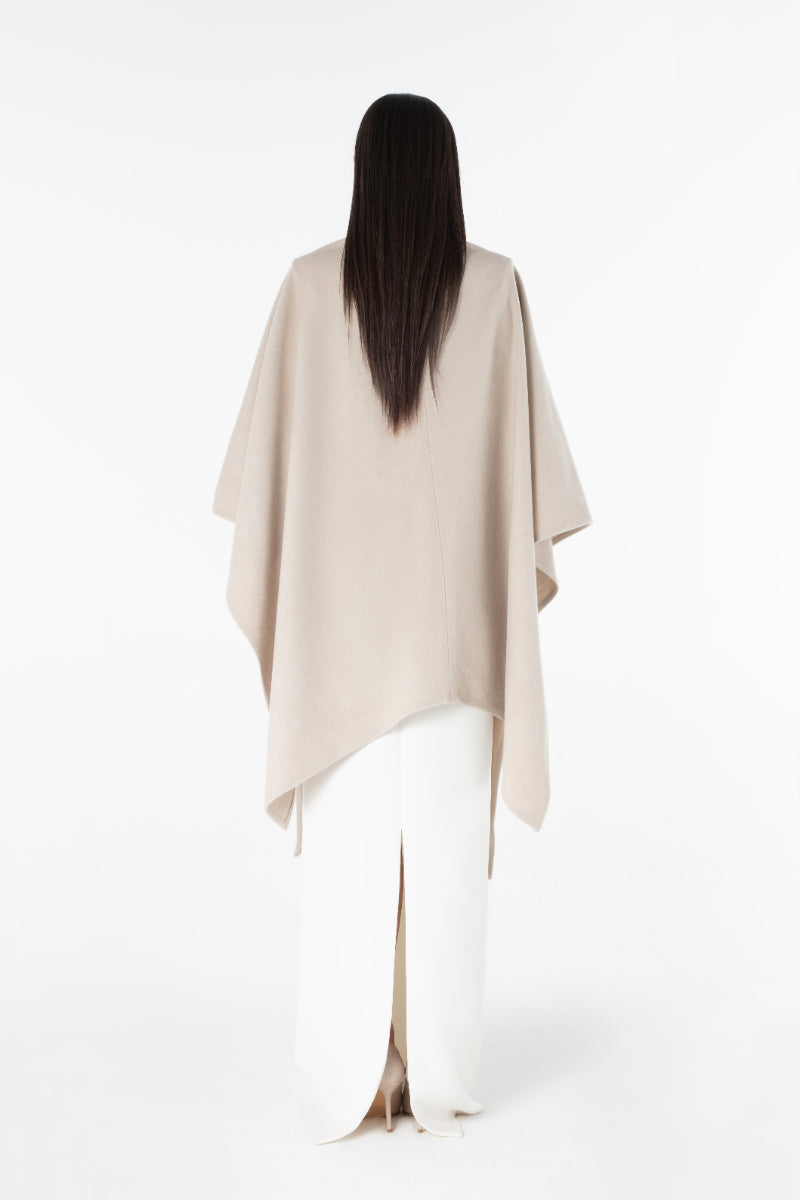 Lili Blanc oversized cardigan cape in soft knit fabric, draped open-front design with wide sleeves and cozy fit.