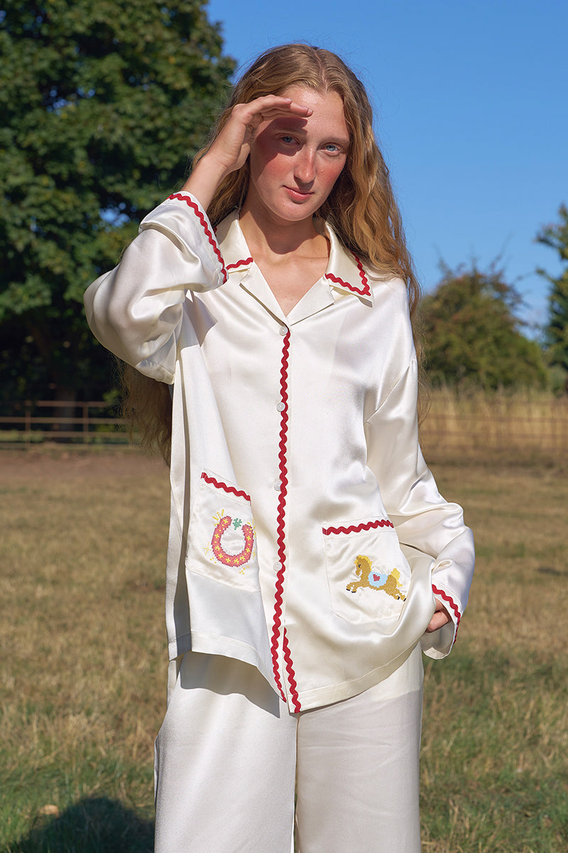Lucky Pony women's silk long pajamas set featuring smooth, shiny silk fabric and a relaxed fit, with a button-up top and matching pants.
