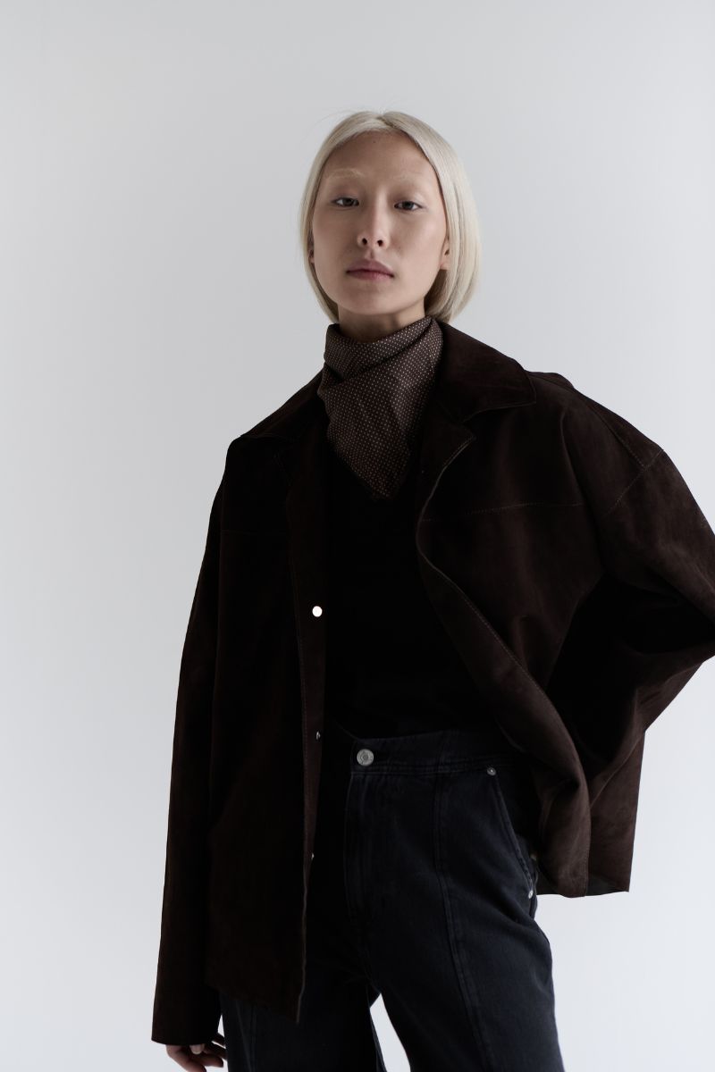 ZUT Meydan suede jacket with a classic collar, front zipper, and stylish design, shown in a close-up of the brown suede material.