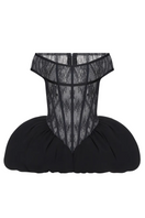 Black THEA mini dress by BALYKINA, shown on a model, featuring a stylish and fitted design perfect for elegant occasions.