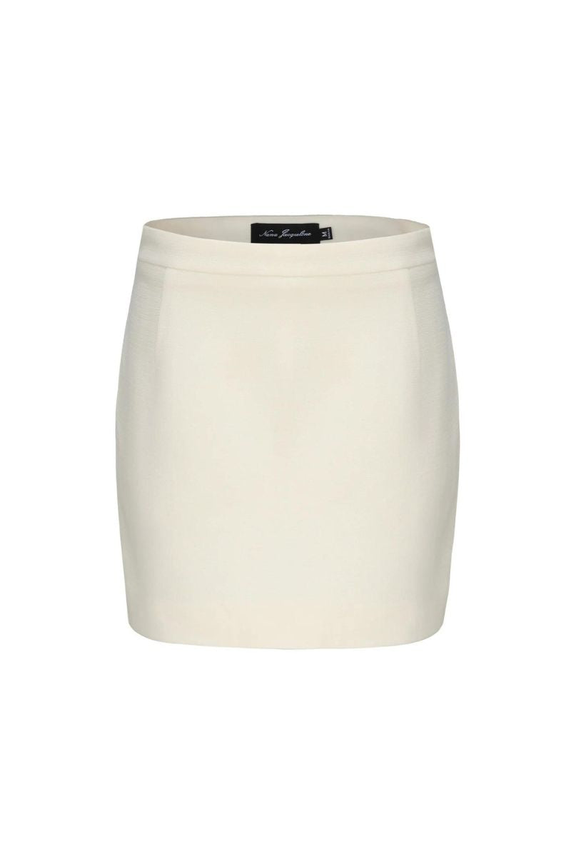 Nana Jacqueline Lisette white mini skirt shown on a model, fitted style with clean lines and a high waist.