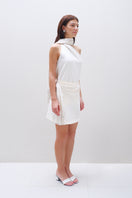 Aidan & Ice Amira Mini Skirt in cream, showcasing a stylish high-waisted mini skirt with a smooth fabric finish.