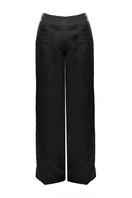 Black ONYX pants by BAÉ, stylish and fitted, shown on a model with a close-up of the fabric and waistband details.