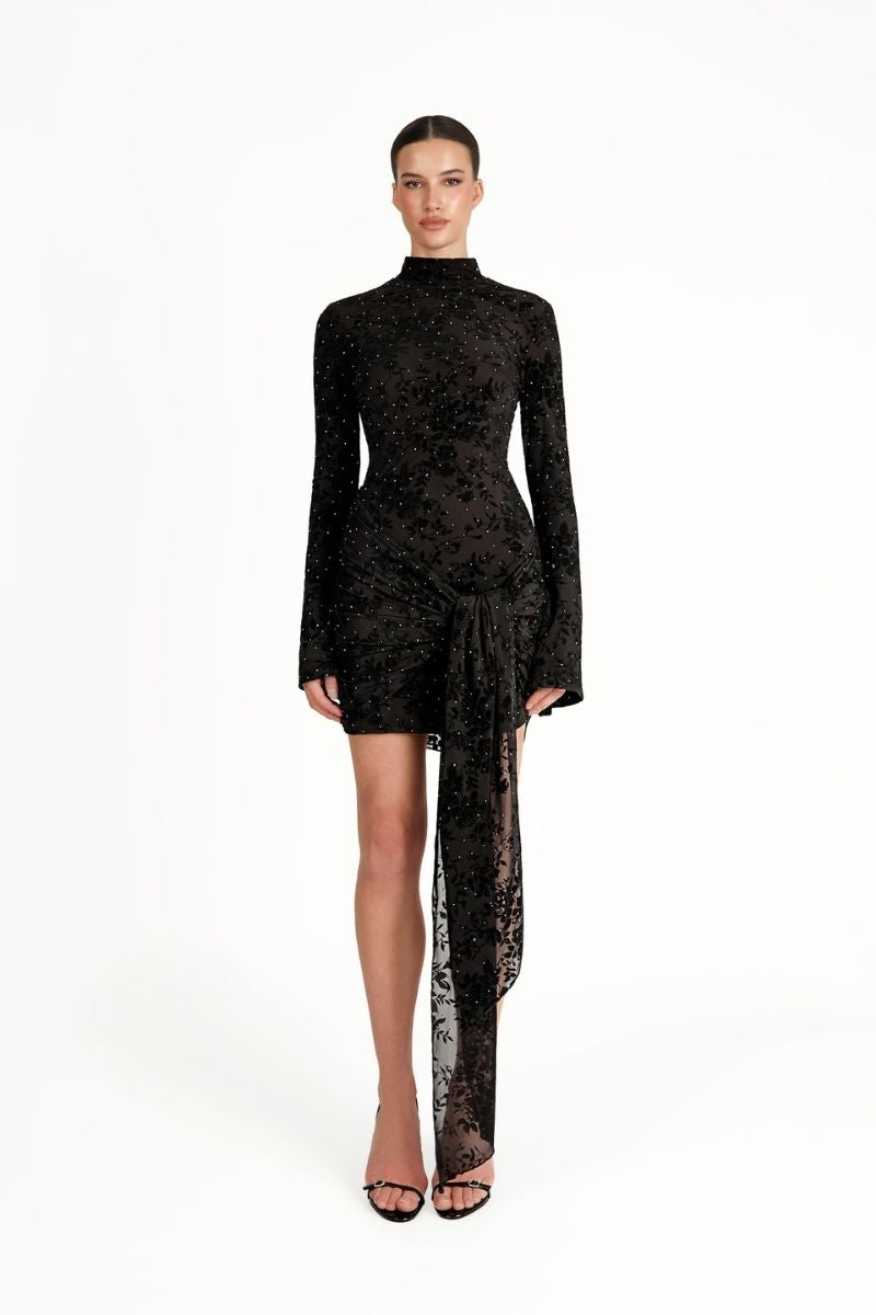 Black KALESY mini dress by Khanum's, shown on a model with a fitted silhouette and stylish neckline.
