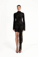Black Kalesy mini dress by Khanum's, sleeveless and fitted, shown on a model with a stylish, casual look.