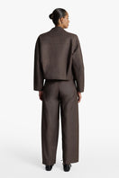 Acaria Studio Sahara jacket in coffee color, stylish outerwear with a cozy fit, displayed on a model.