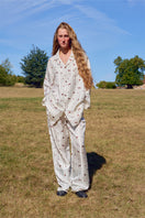 Unisex brown printed twill pajama set with long sleeves and pants, featuring a relaxed fit and comfortable fabric.
